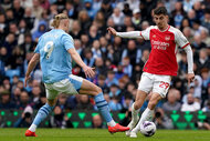 Kai Havertz battles for the ball against Manchester City's Erling Haaland