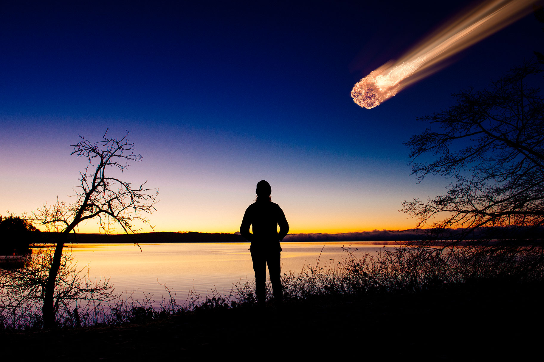 Woman watching a meteor in the sky