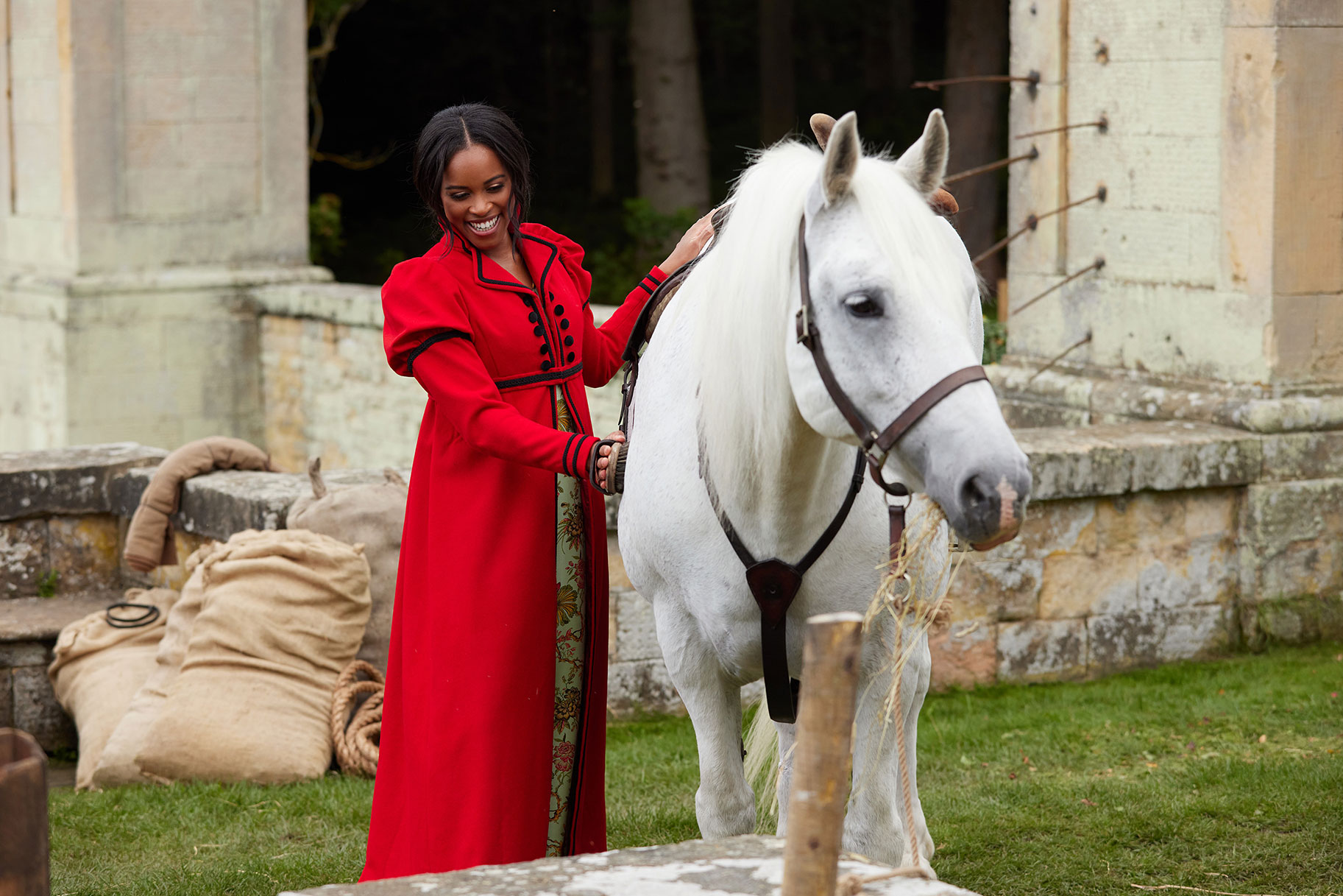 The Courtship's Nicole Remy Petting A Riding Horse