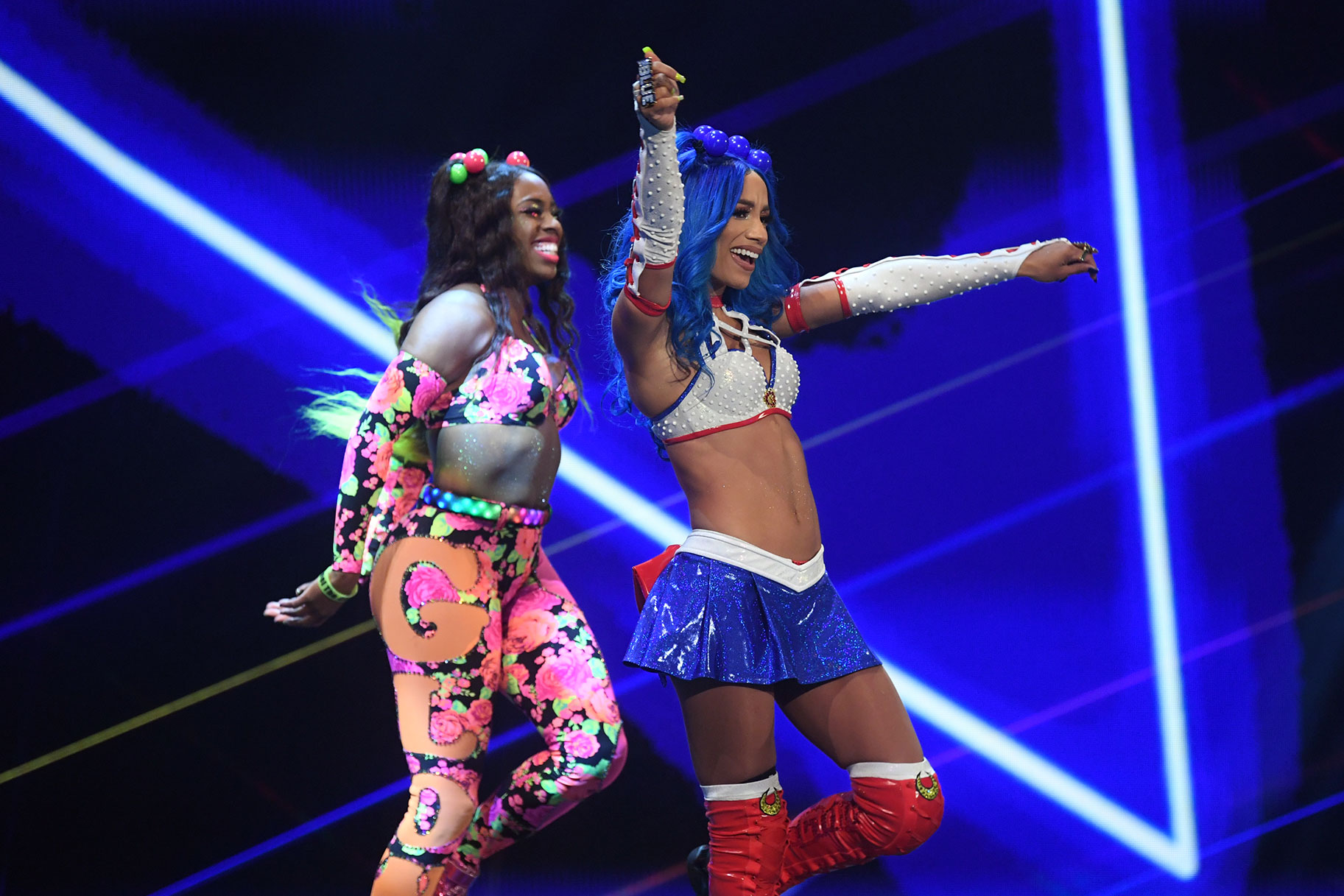 Sasha Banks and Naomi dancing ringside