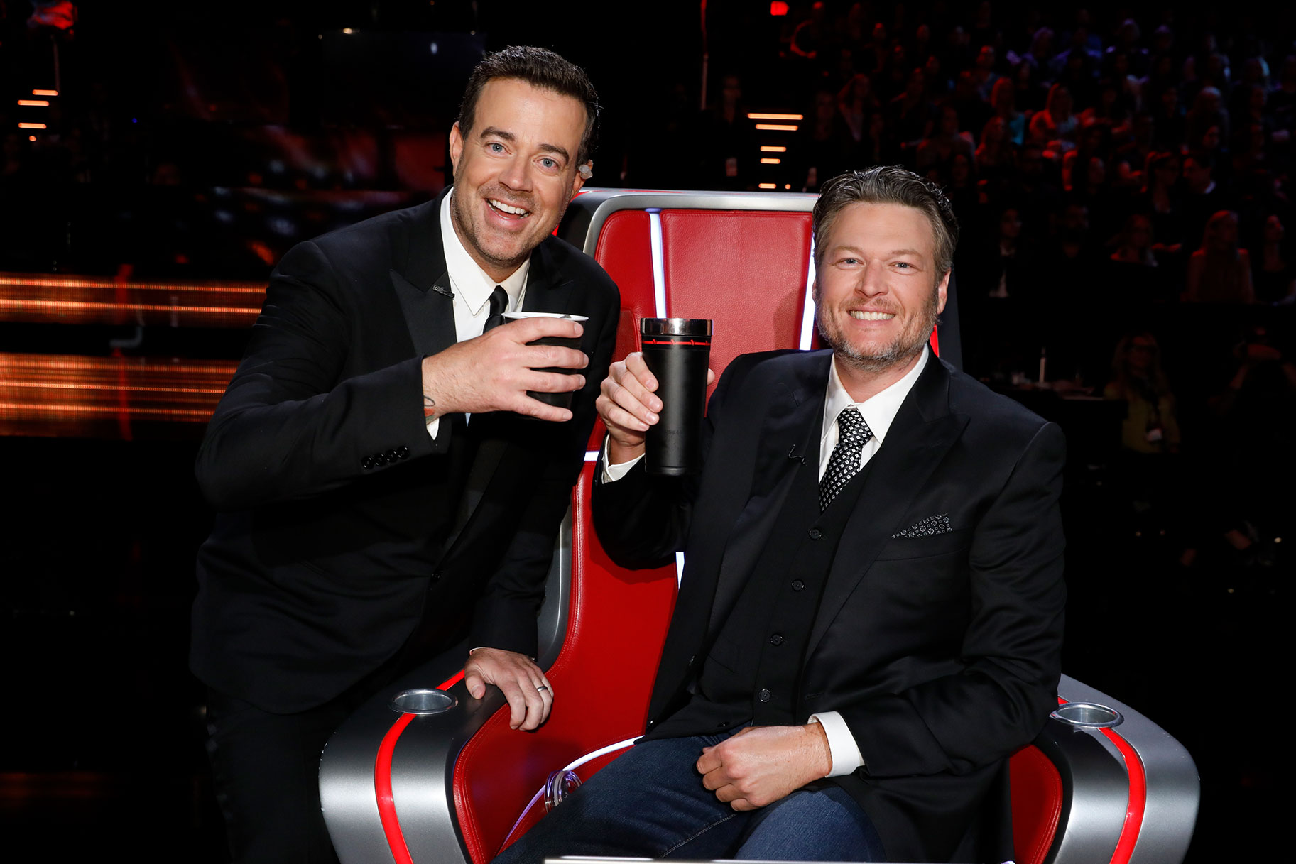 Carson Daly and Blake Shelton smiling and posing on the set of 'The Voice'