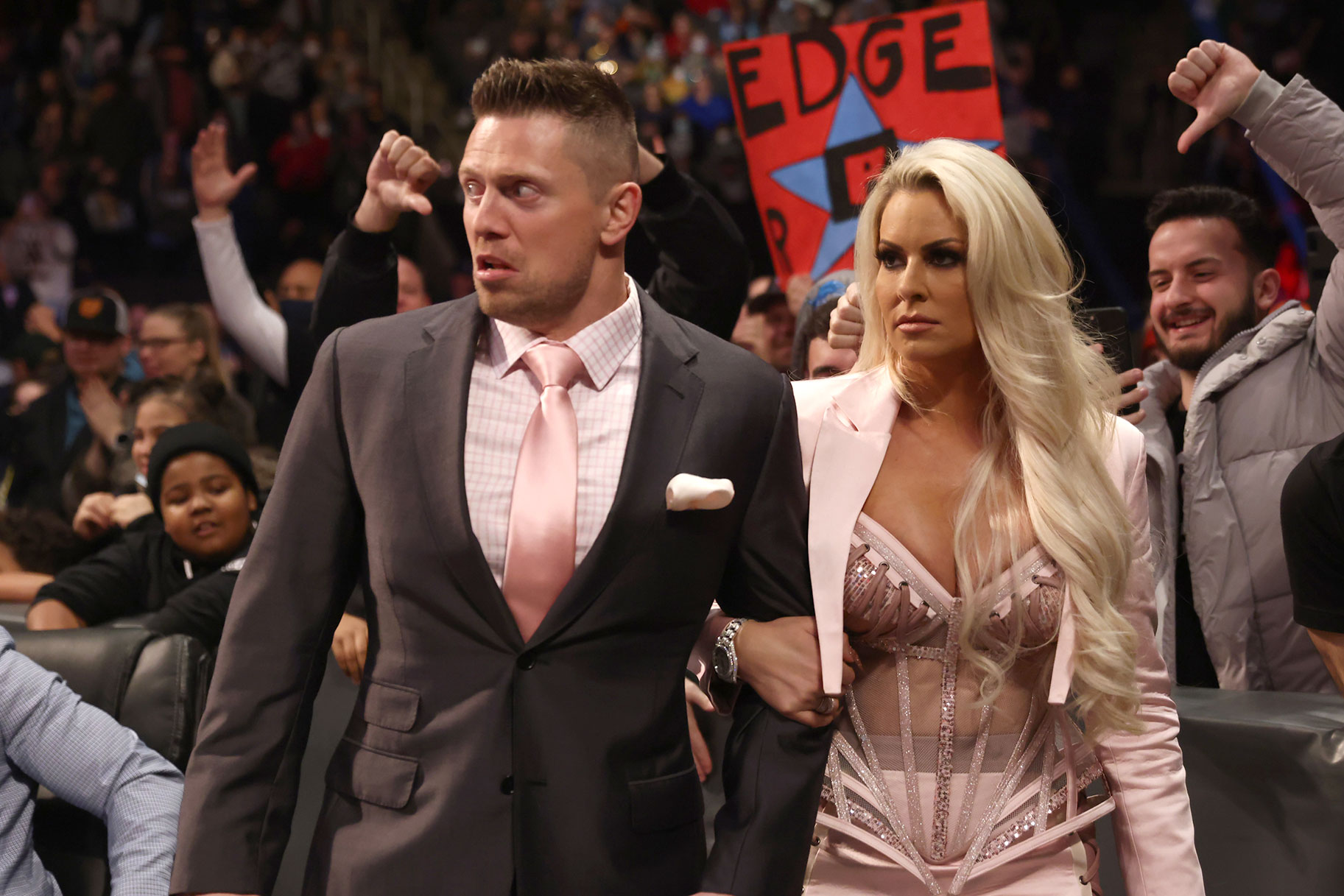 The Miz and Maryse outside of the ring being boo'd by the audience