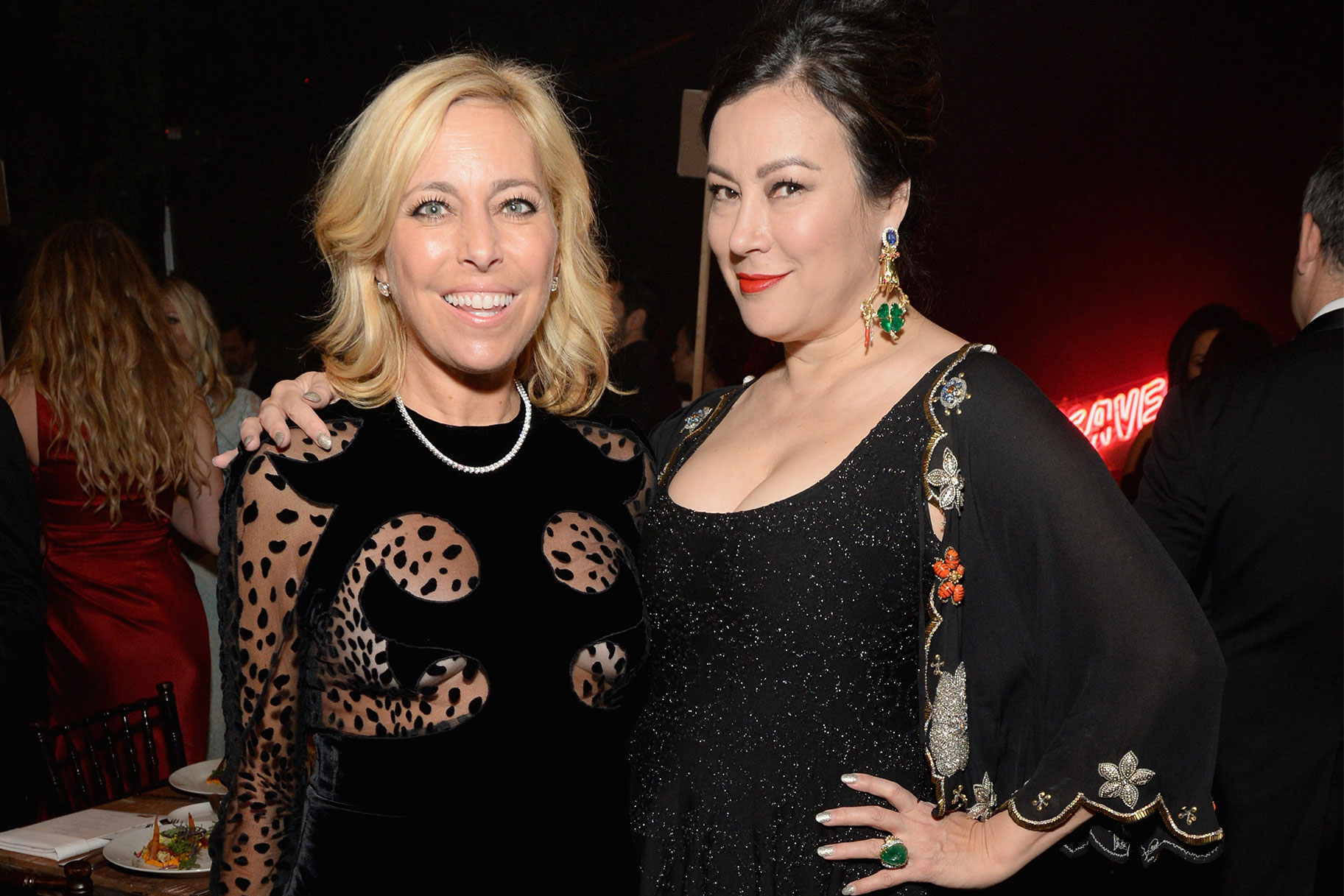 Sutton Stracke and Jennifer Tilly posed together. Both are wearing black dresses