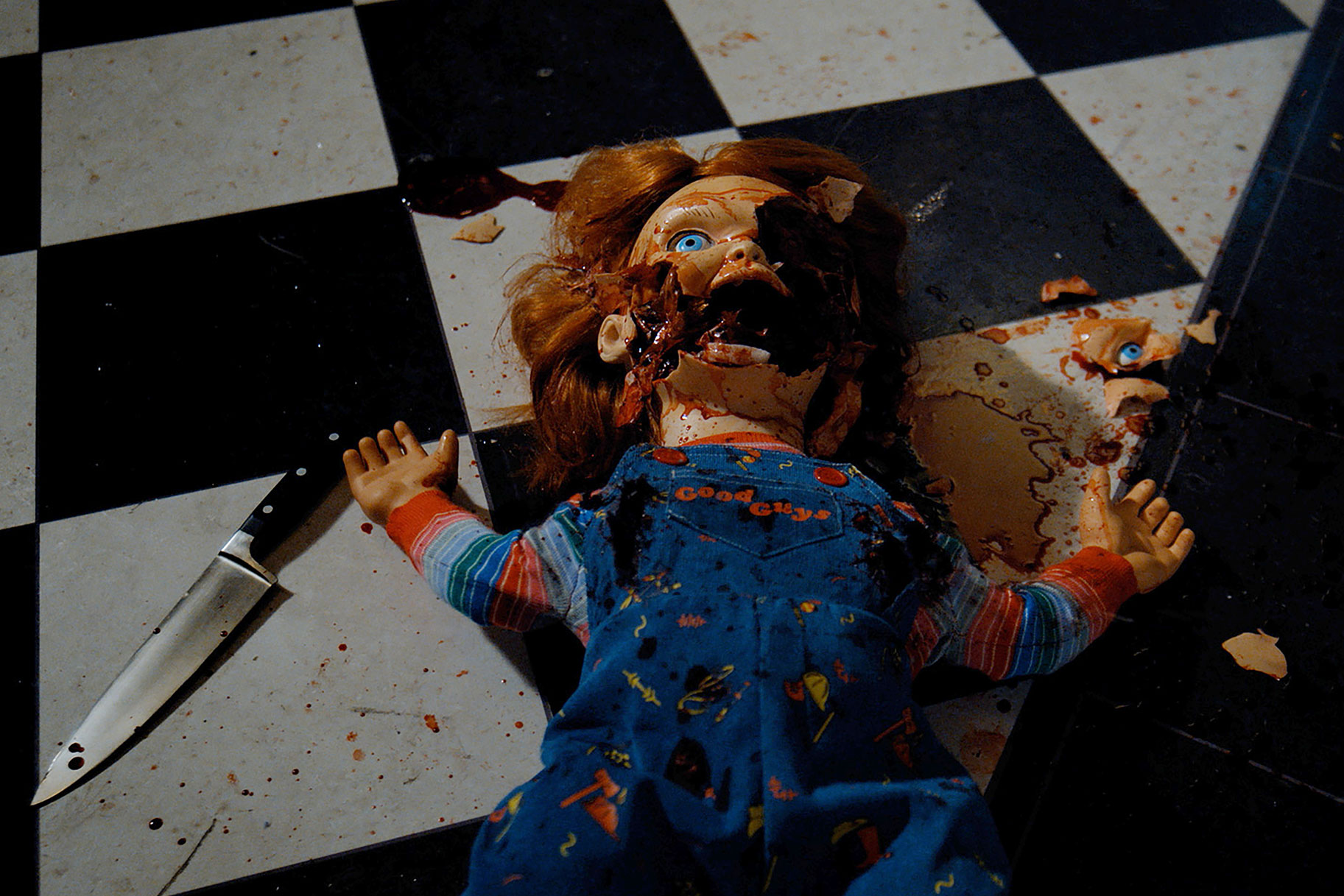 Smashed Chucky layed out on the floor