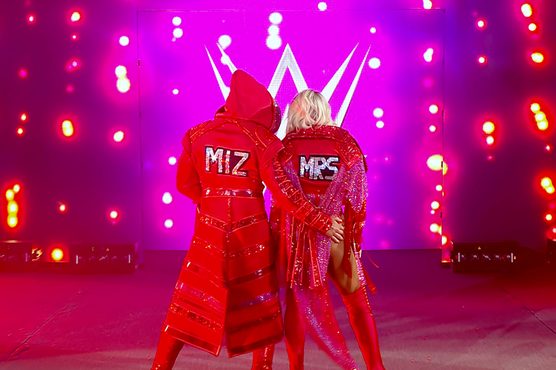 Miz and Maryse wearing red sparkly robes