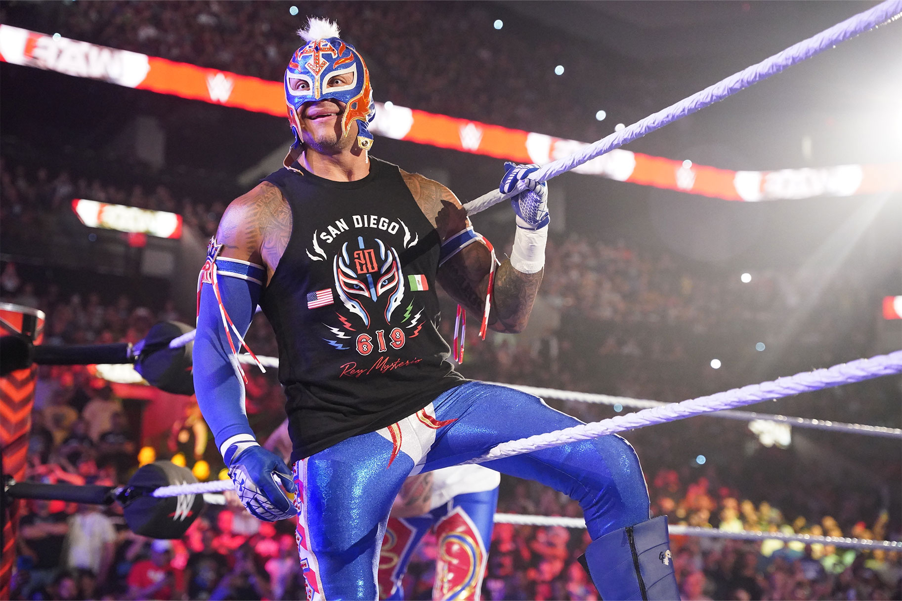 Rey Mysterio leaning on the ropes of the ring