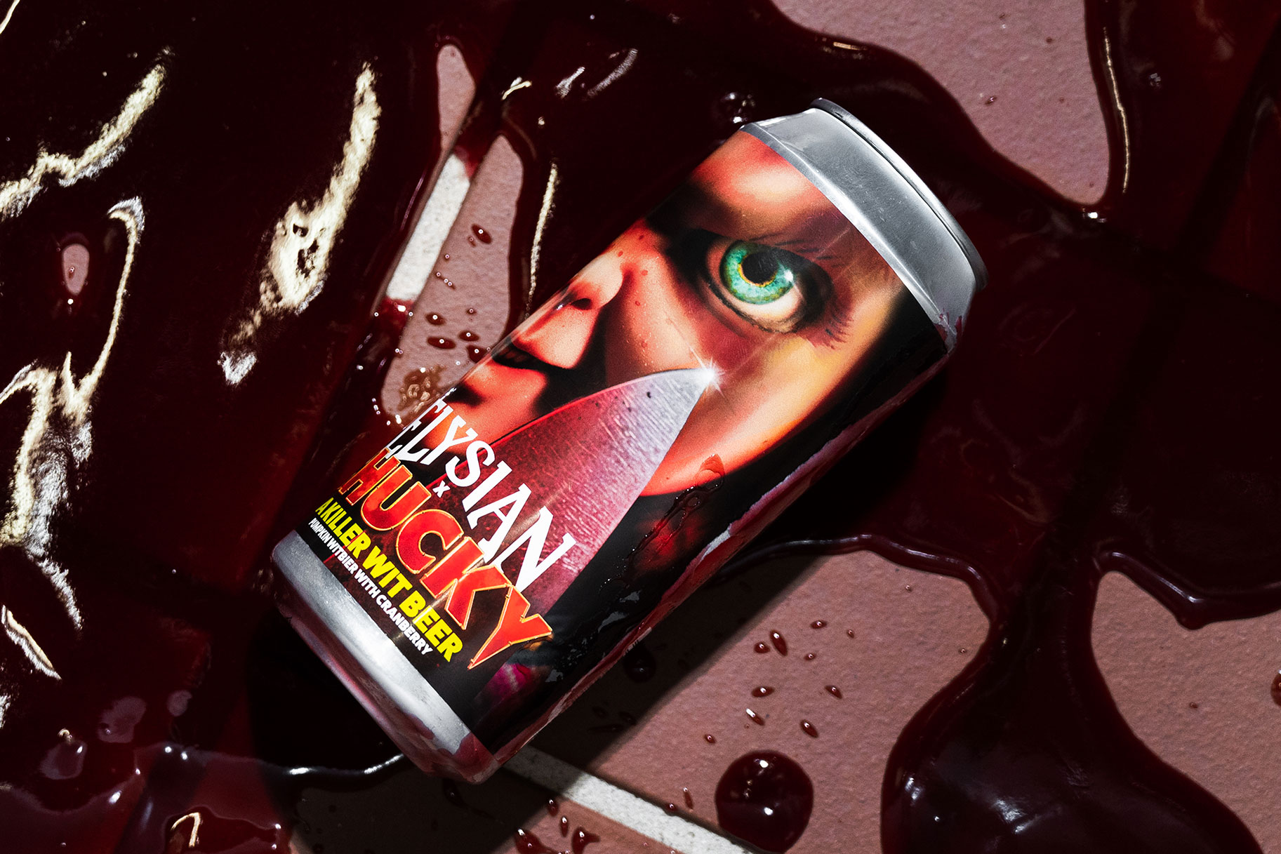 A can of Chucky beer laid in a puddle of blood