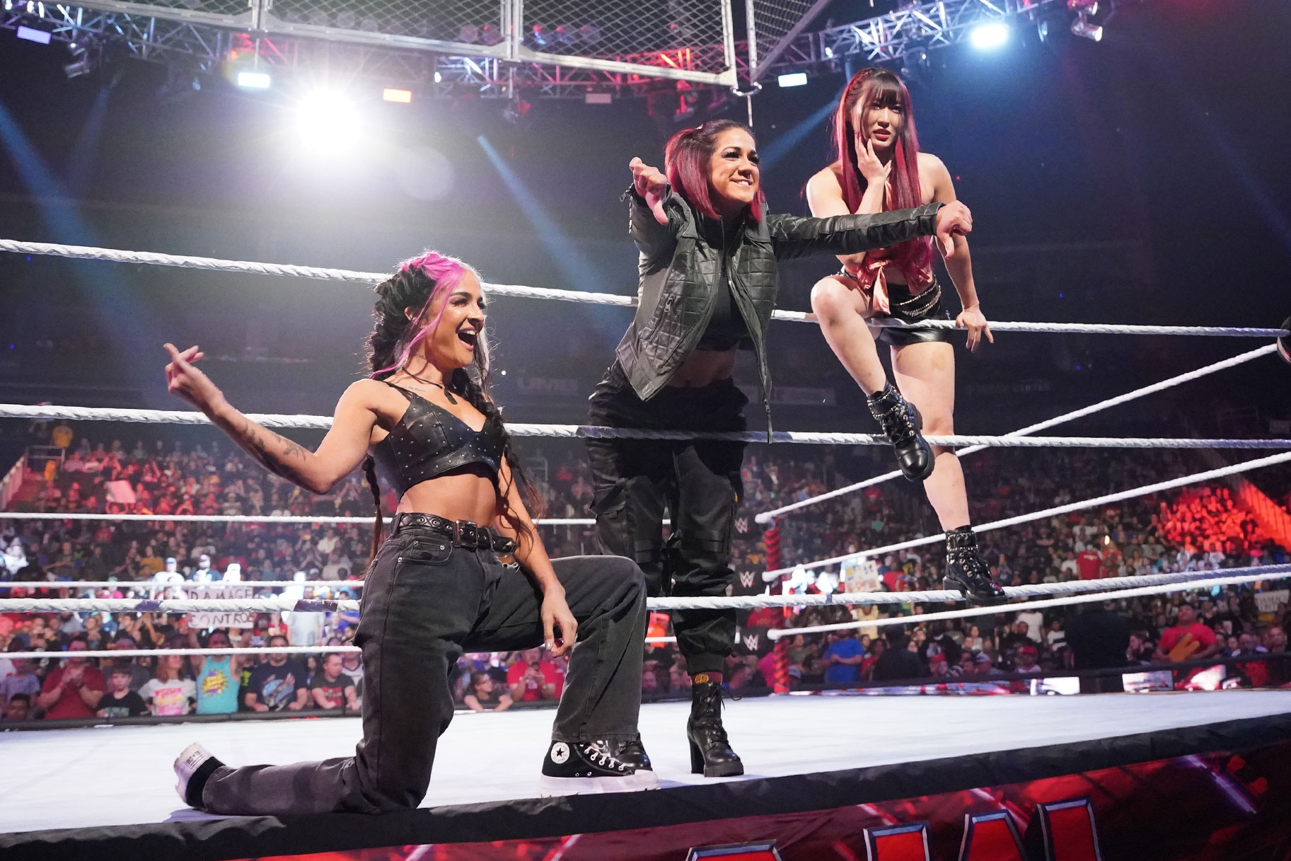 WWE's Damage Ctrl celebrating their victory in the ring