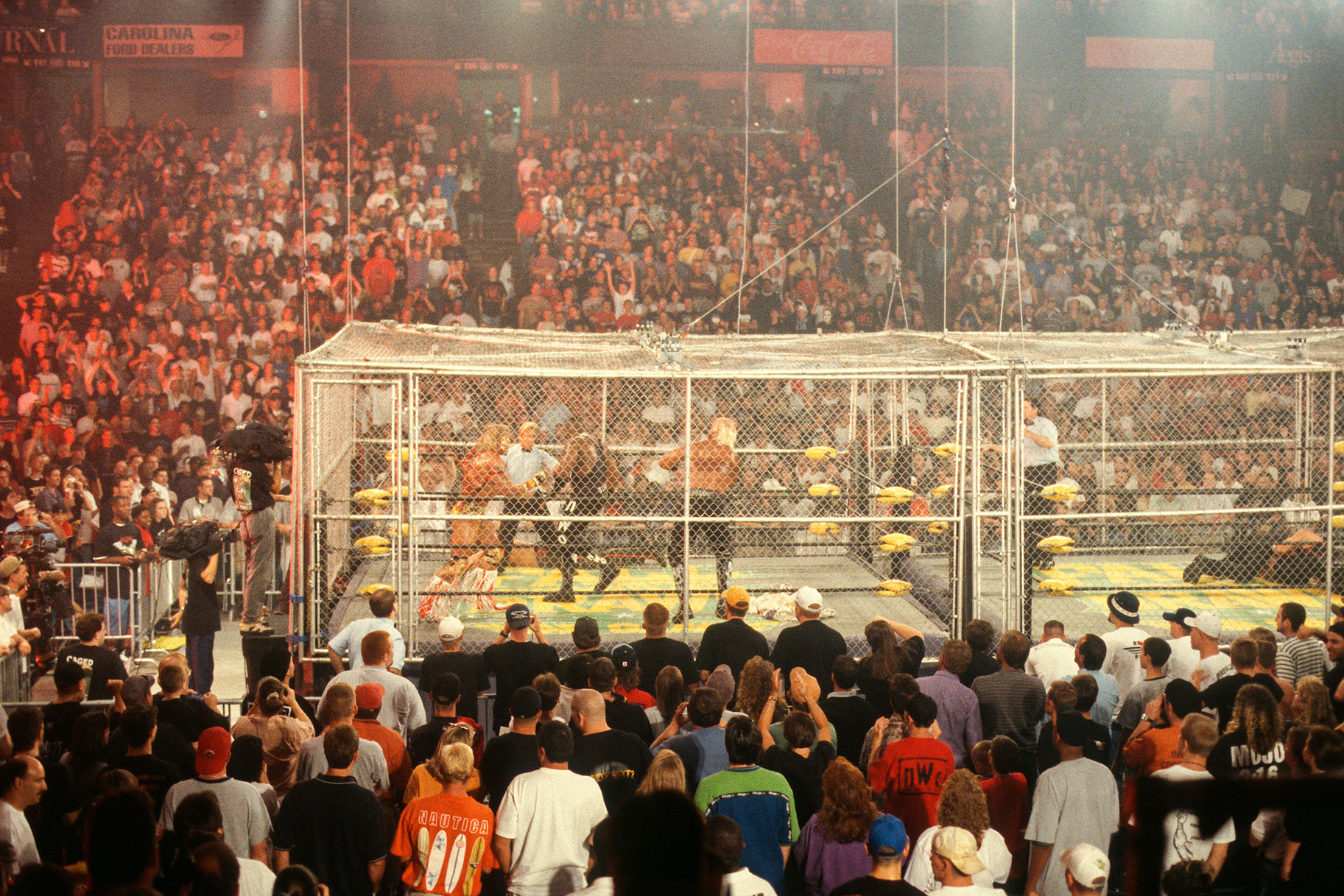 A cage surrounding the wrestling ring