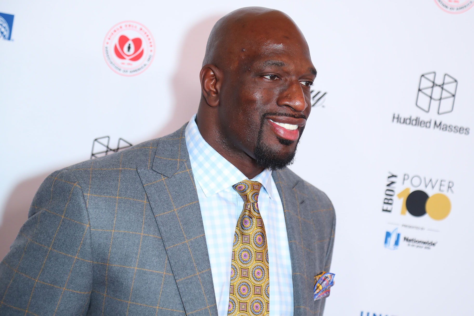 Titus O'Neil smiling on the red carpet
