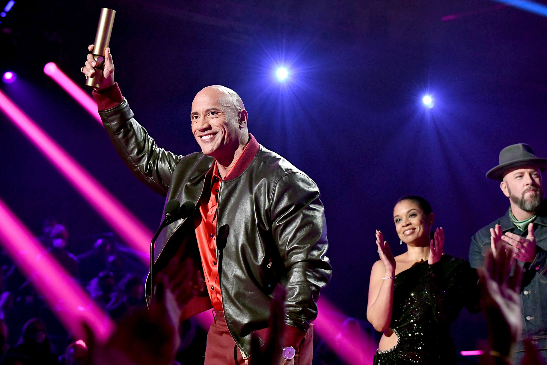 Dwayne Johnson onstage winning a Peoples Choice Award