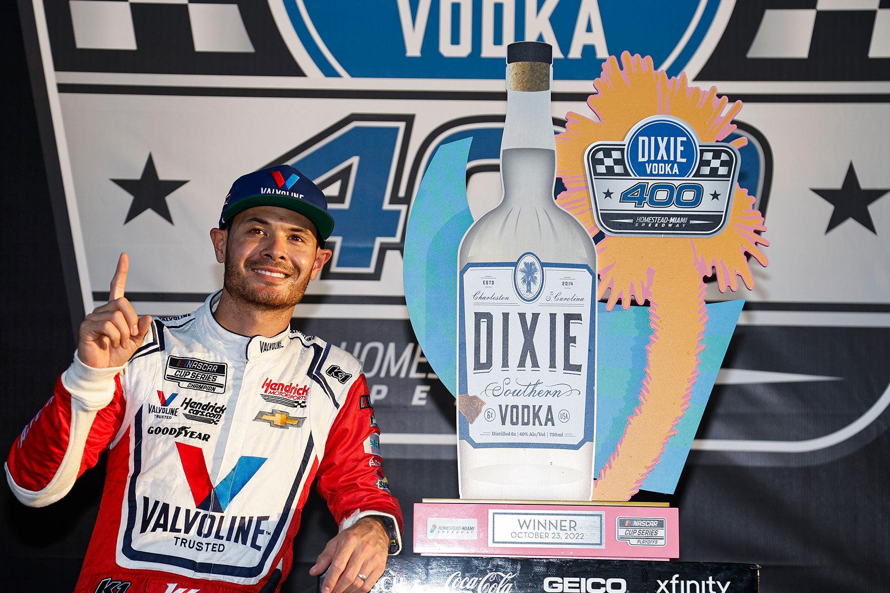 Kyle Larson, driver of the #5 Valvoline Chevrolet, celebrates in victory lane after winning the NASCAR Cup Series Dixie Vodka 400