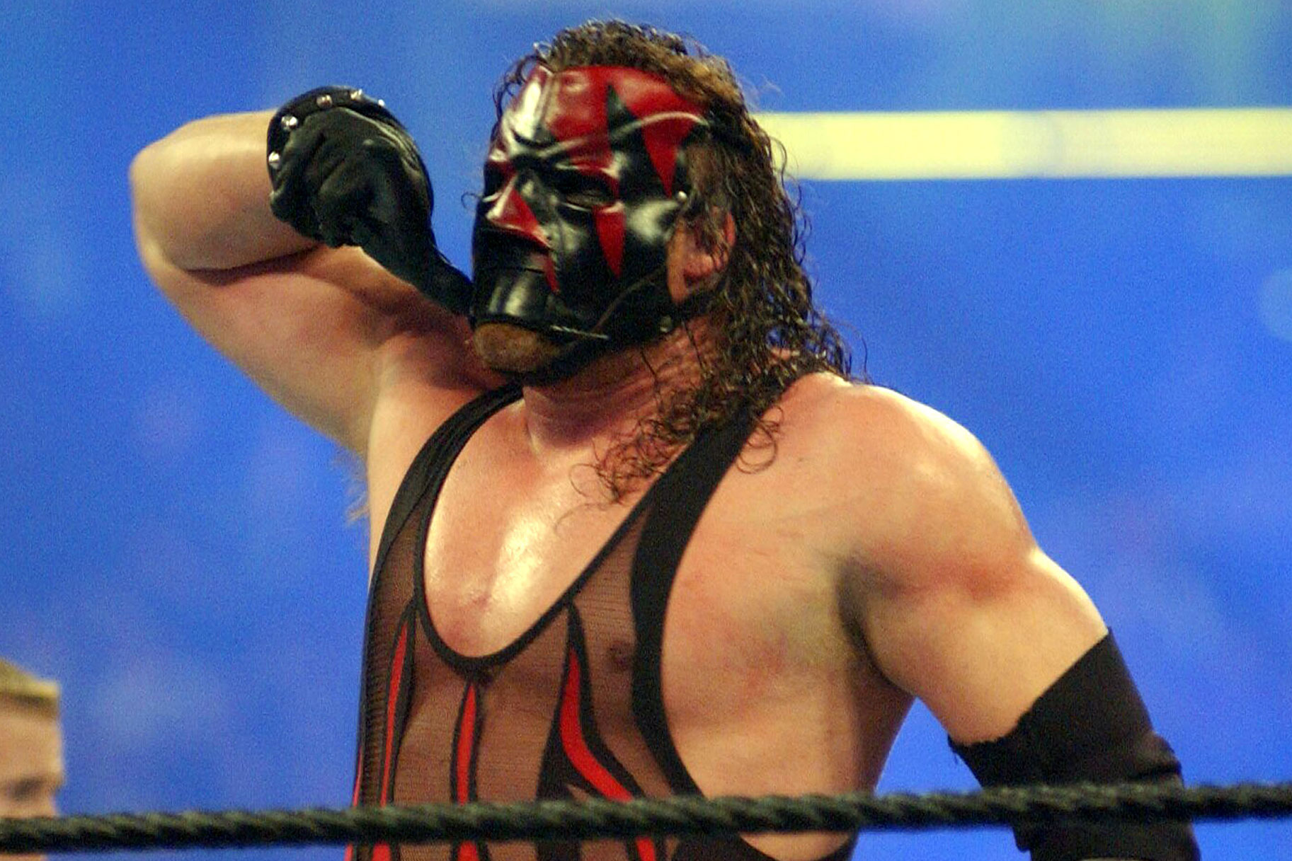 Kane in the ring with his red and black mask on