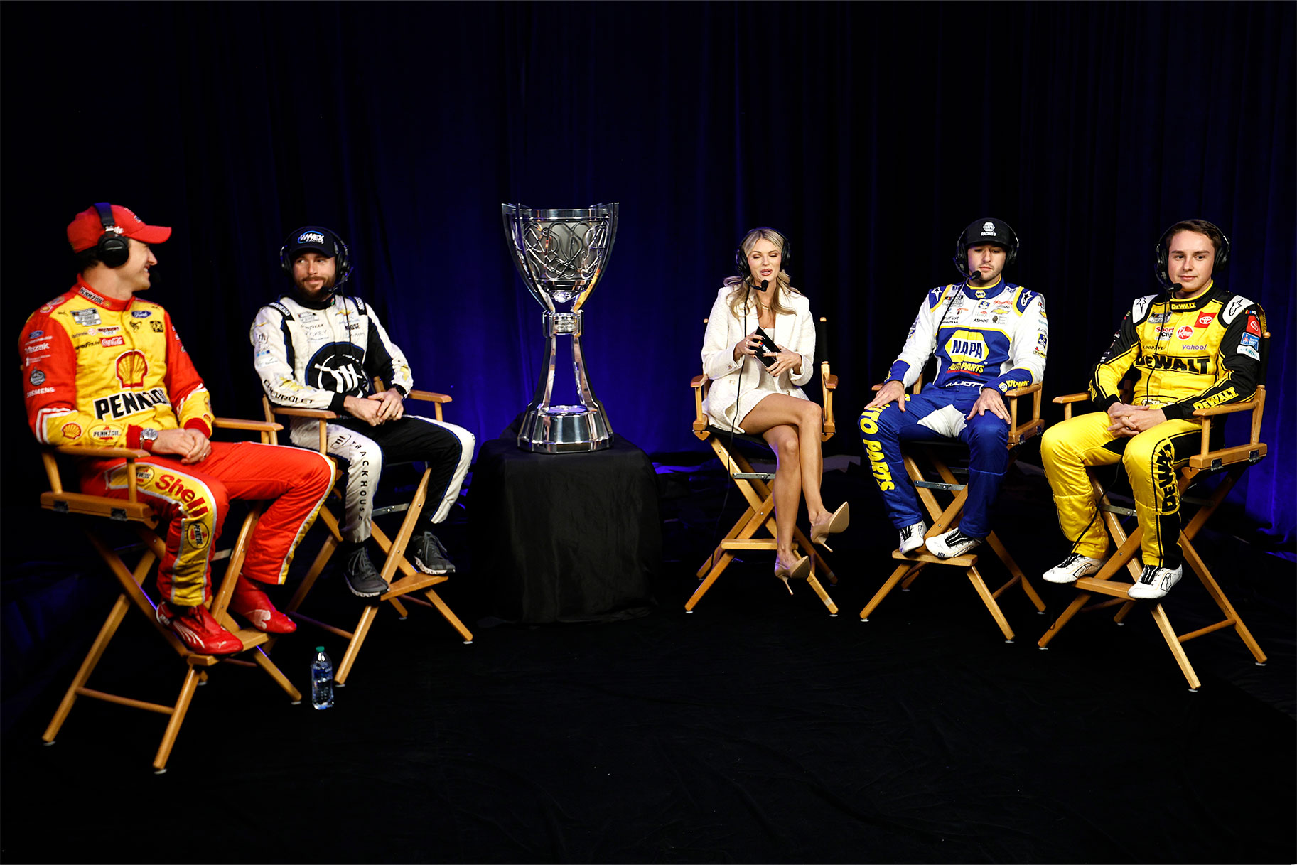 L-R) Joey Logano, driver of the #22 Shell Pennzoil Ford, Ross Chastain, driver of the #1 Moose Fraternity Chevrolet, host Alex Weaver, Chase Elliott, driver of the #9 NAPA Auto Parts Chevrolet, and Christopher Bell, driver of the #20 DeWalt Toyota, talk during a roundtable discussion at the NASCAR Championship 4 Media Day
