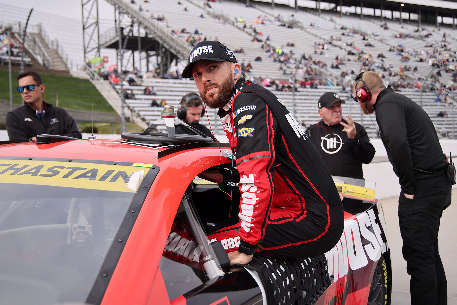 Ross Chastain, driver of the #1 Moose Fraternity Chevrolet, enters his car during qualifying for the NASCAR Cup Series Xfinity 500 at Martinsville Speedway