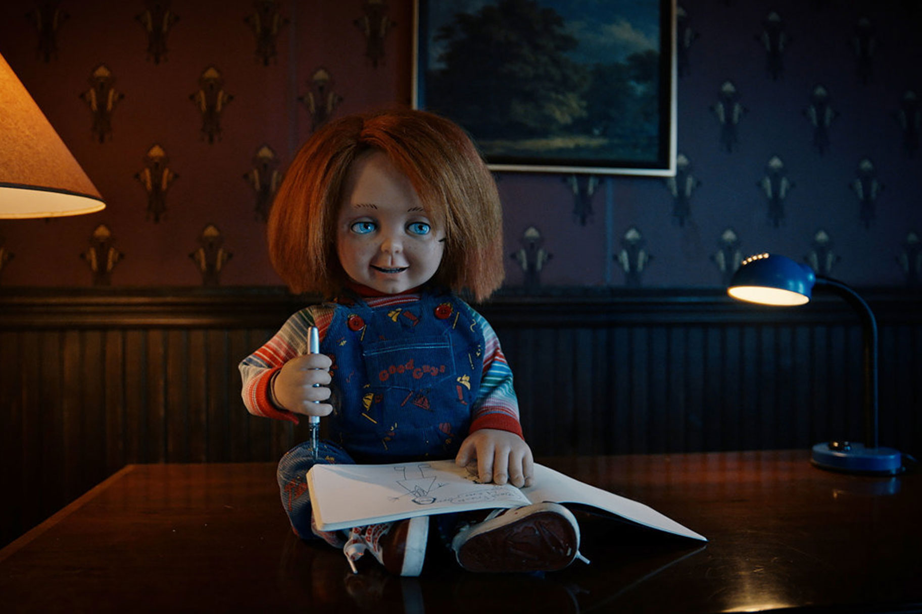 Chucky sitting on a desk