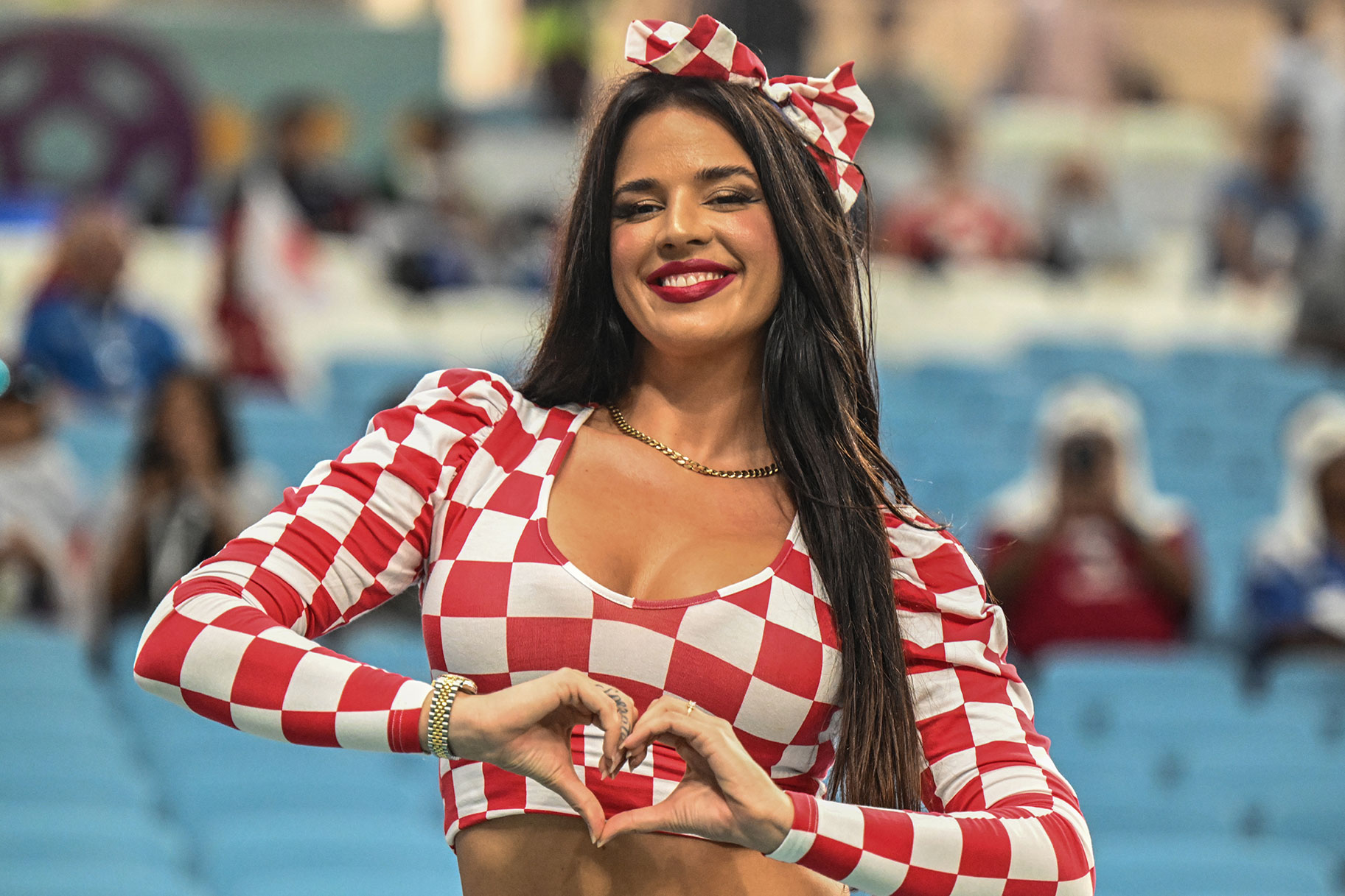 vana Knöll, a model from Croatia, poses in the stands before the match