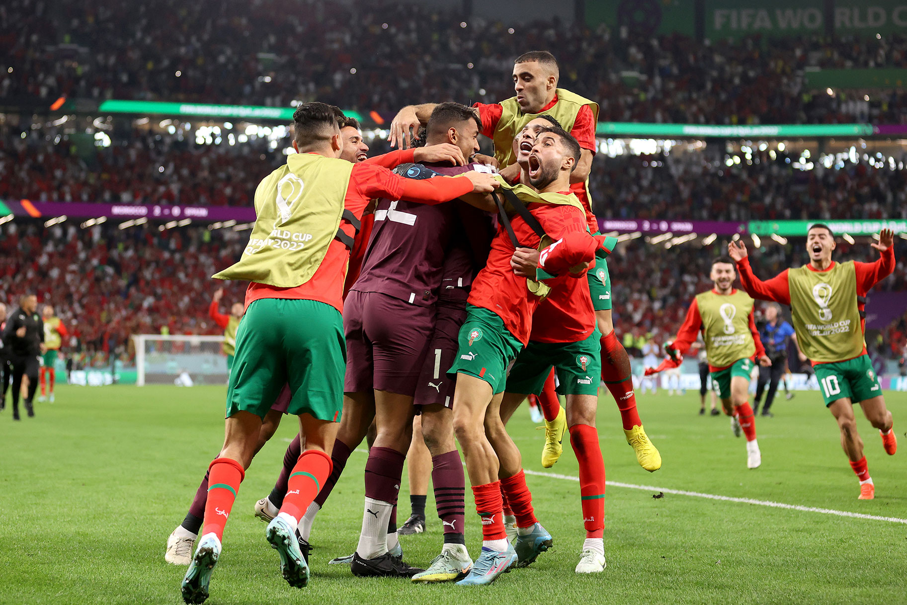 Morocco players celebrates after the team's victory in the penalty shoot out during the FIFA World Cup Qatar 2022 Round of 16 match between Morocco and Spain