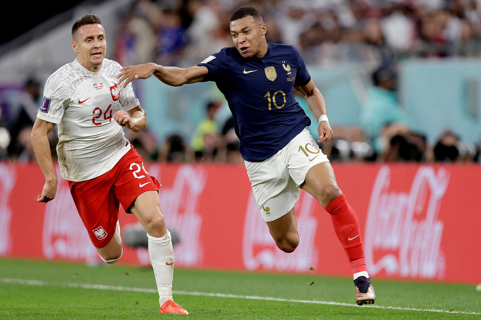 L-R) Przemyslaw Frankowski of Poland, Kylian Mbappe of France during the World Cup match between France v Poland