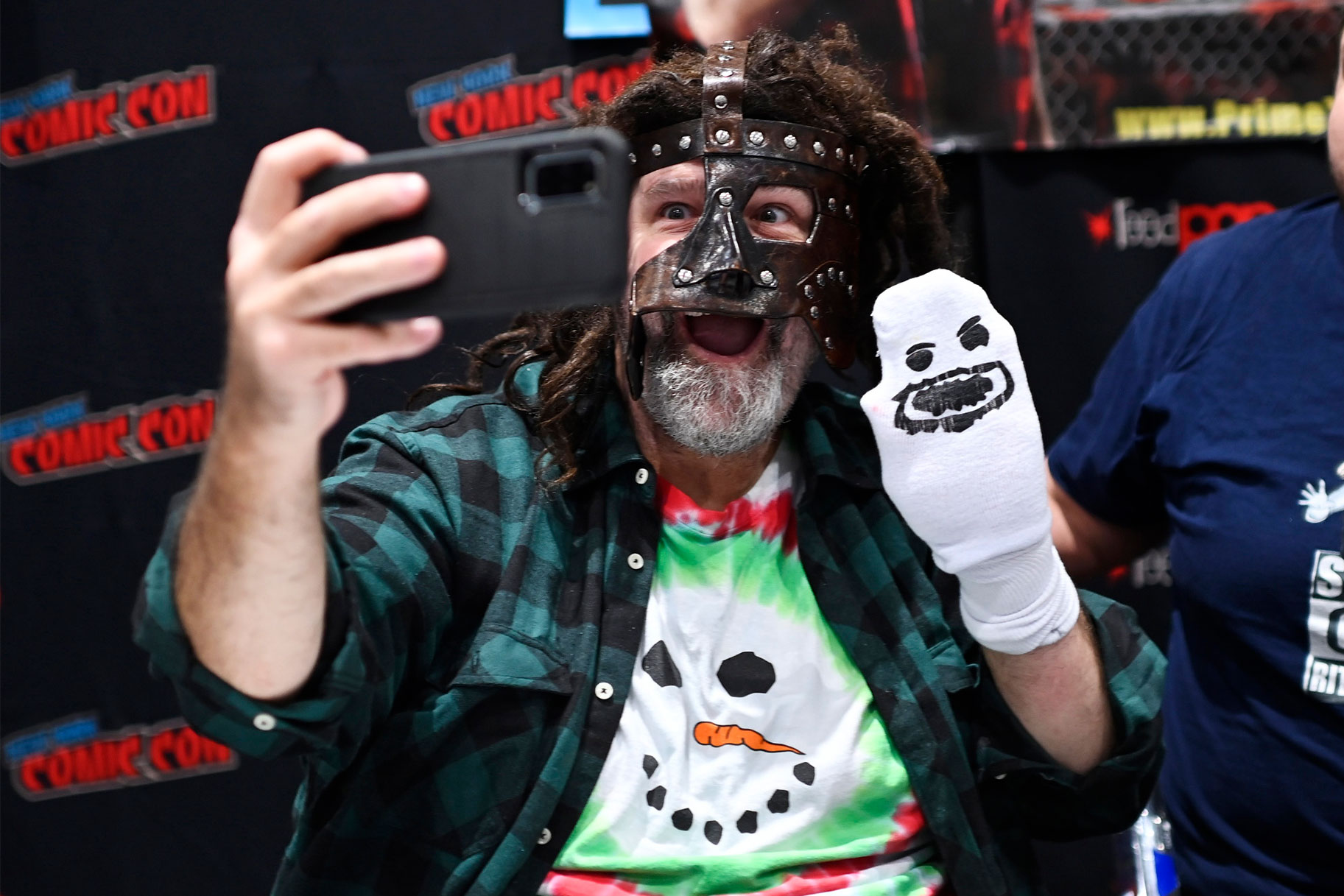 Mick Foley wearing a snowman shirt