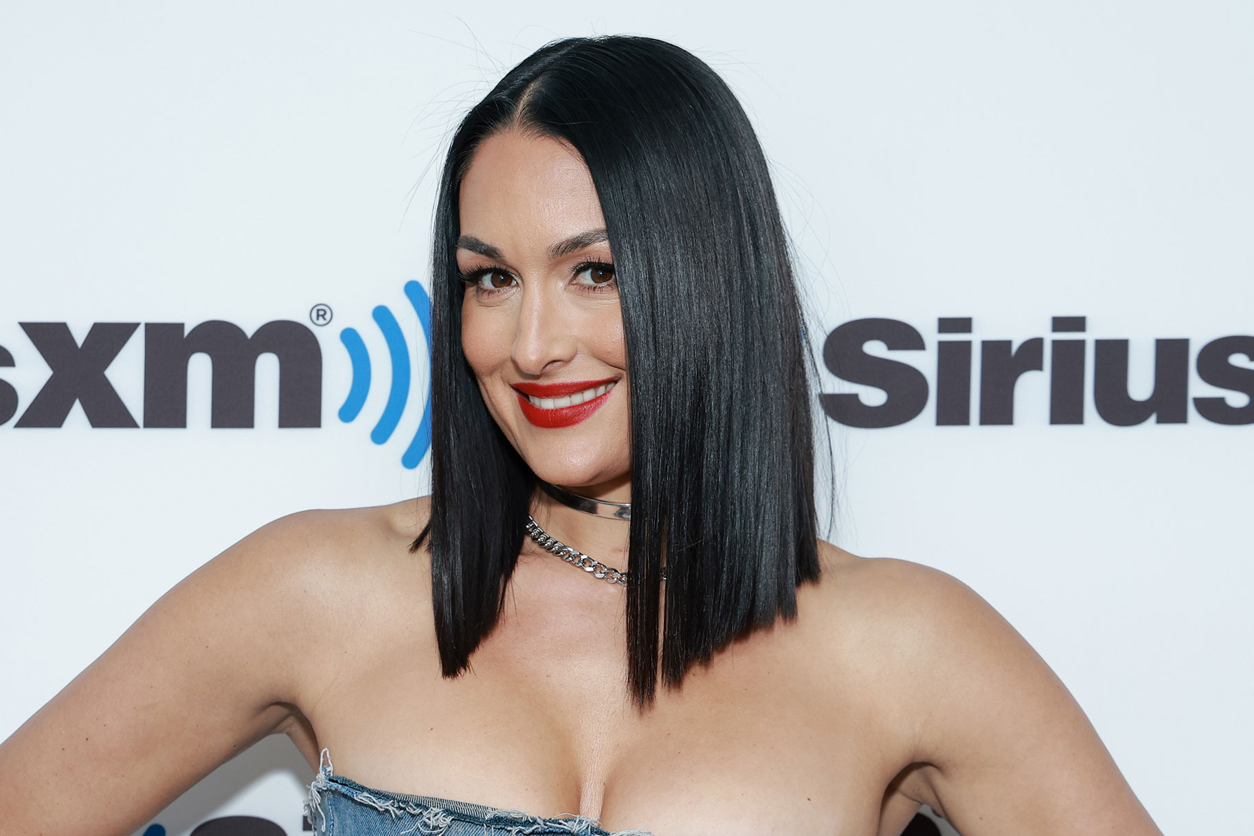 Nikki Bella puts on a busty display in triple denim outfit as she promotes  her show Barmaggedon