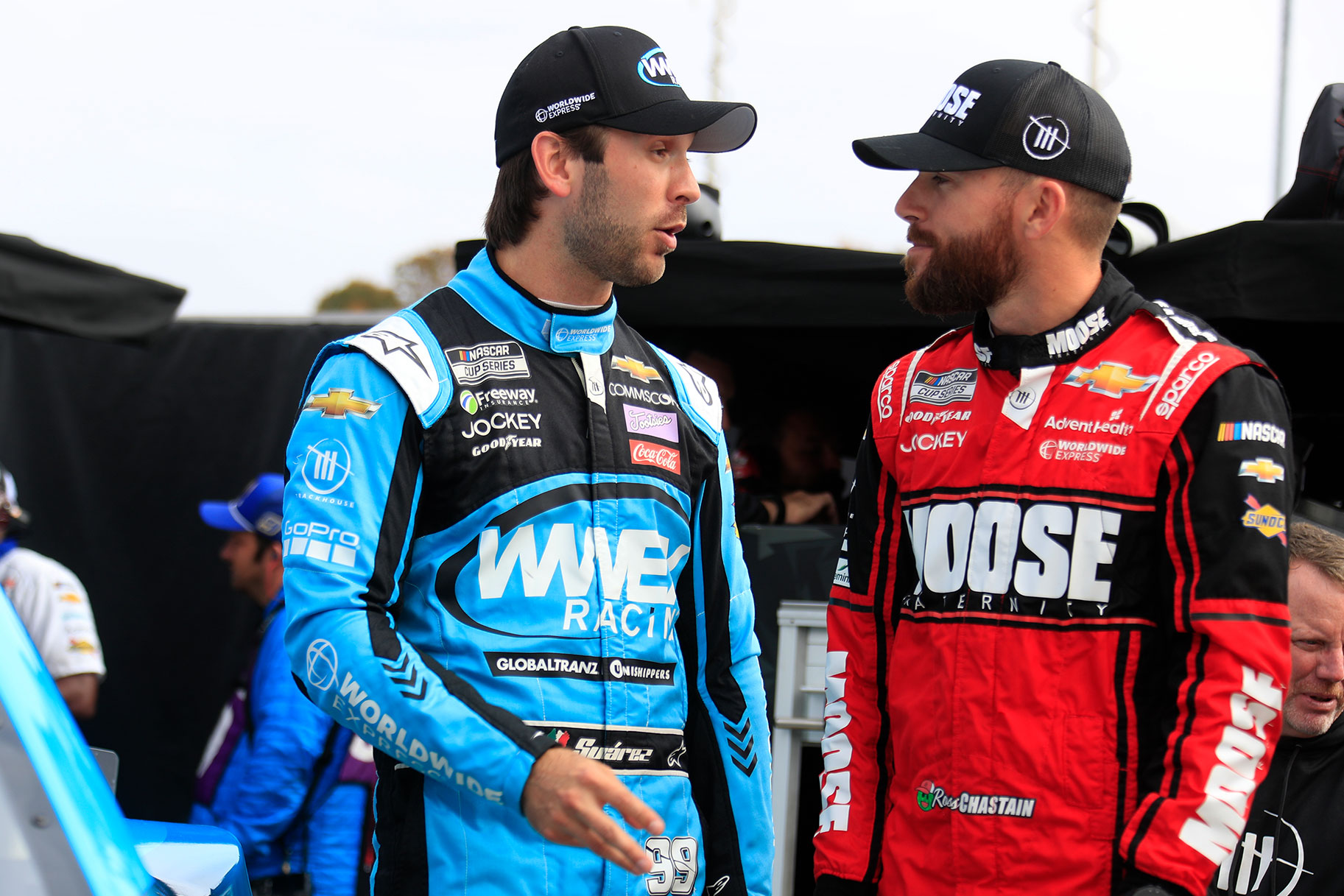 Daniel Suarez (#99 TrackHouse Racing Worldwide Express Chevrolet) talks with teammate Ross Chastain (#1 TrackHouse Racing Moose Fraternity Chevrolet) during qualifying for the NASCAR Cup Series Playoff Xfinity 500