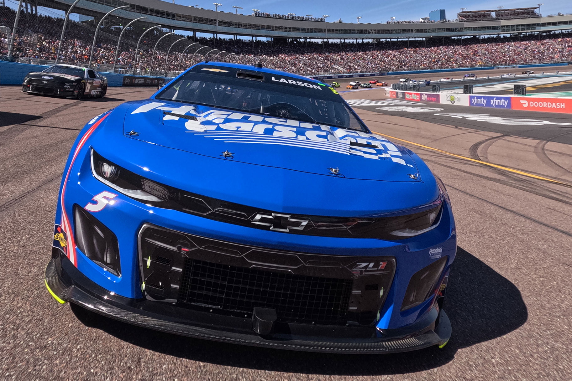 Kyle Larson, driver of the #5 HendrickCars.com Chevrolet, leads the field on a pace lap prior to the NASCAR Cup Series United Rentals Work United 500 at Phoenix Raceway on March 12, 2023