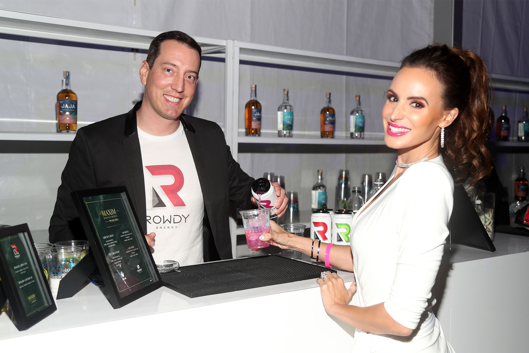 Kyle and Samantha Busch pouring a cocktail