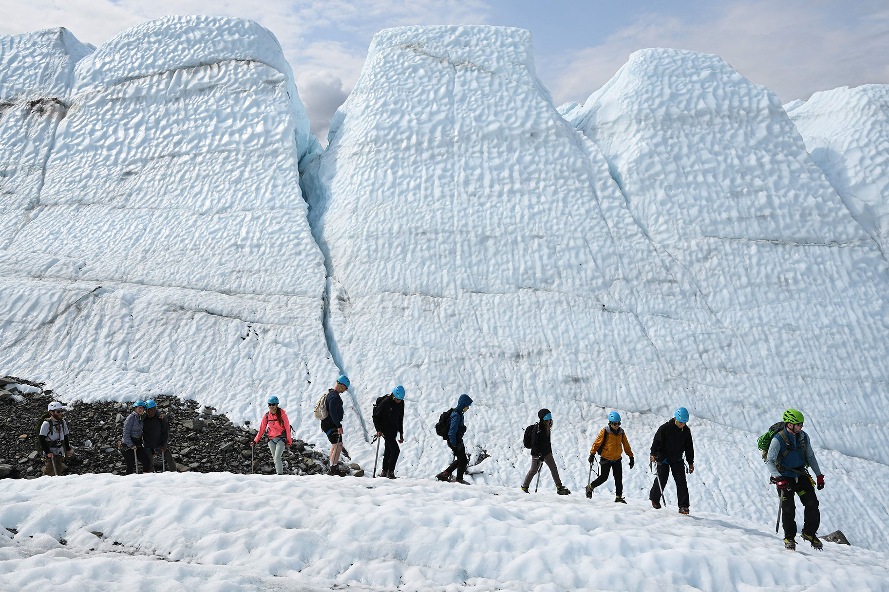 Visitors hike on the ice during a guided tour on the Matanuska Glacier, a 27-mile (43.5kms) long valley glacier feeding water into the Matanuska Rive