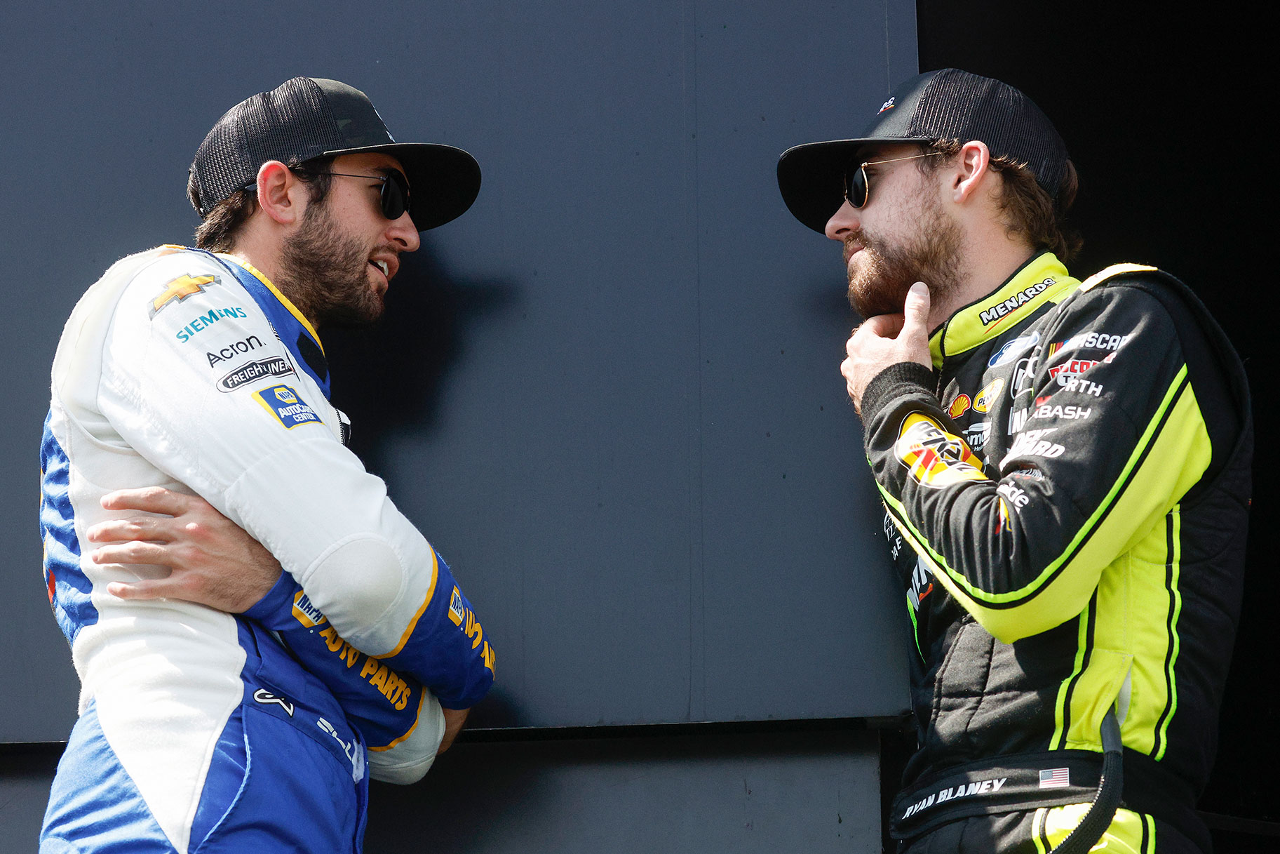 Chase Elliott and Ryan Blaney talk backstage during pre-race ceremonies