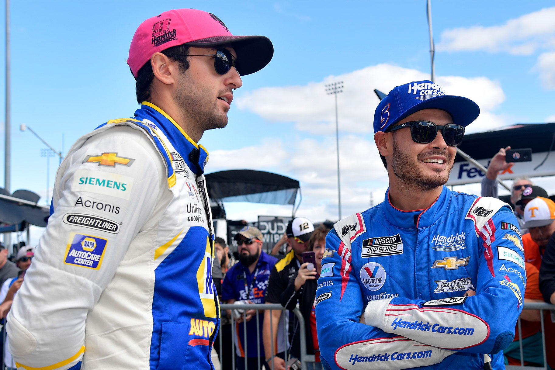 Chase Elliott and Kyle Larson talk on the grid prior to the NASCAR Cup Series Xfinity 500