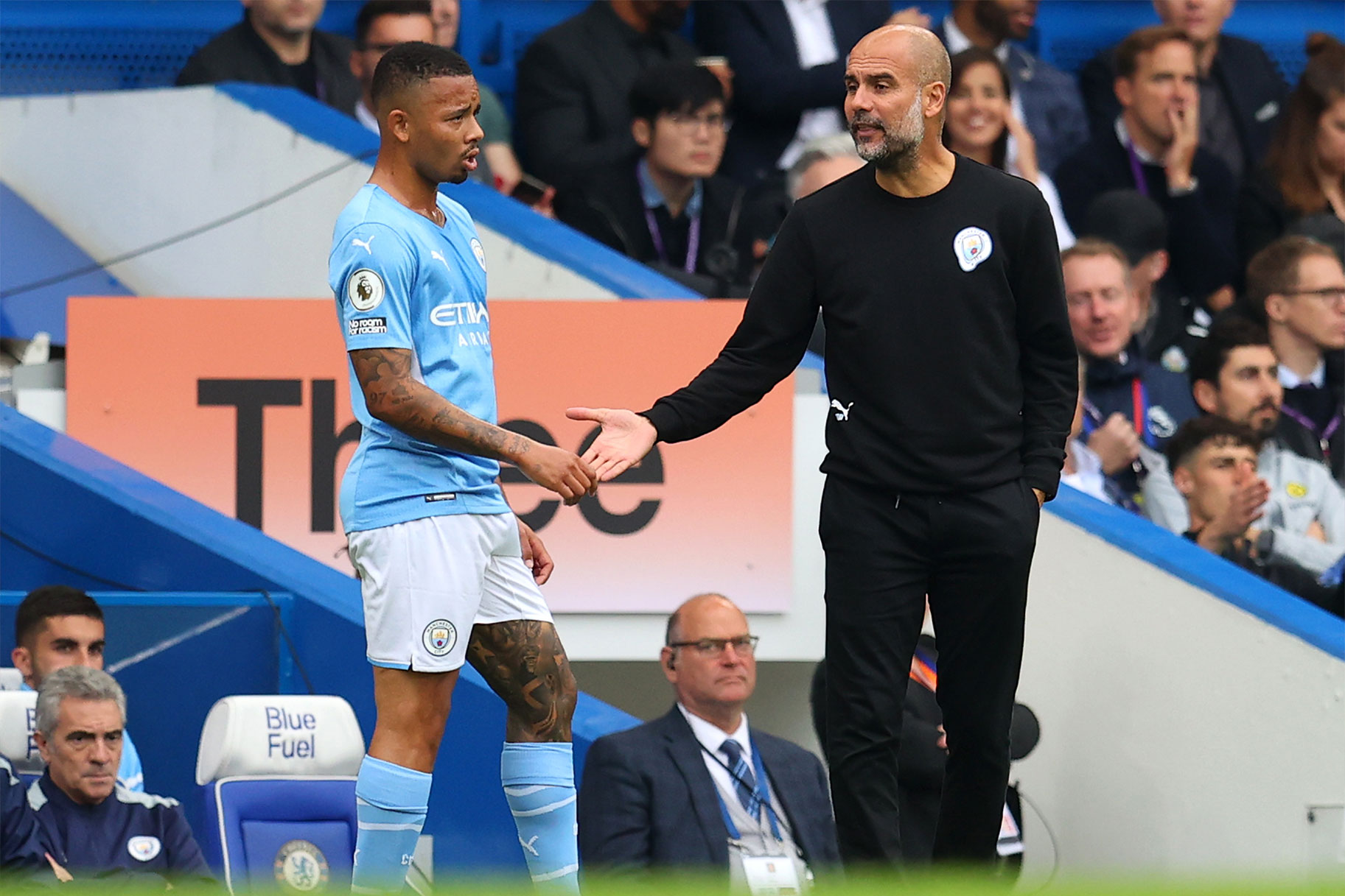 Pep Guardiola, Manager of Manchester City speaks to Gabriel Jesus of Manchester City during a Premier League match