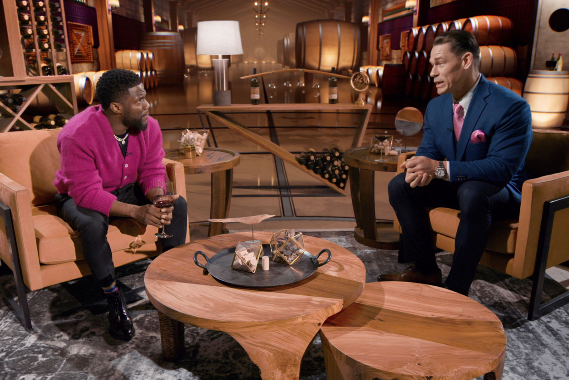 Kevin Hart and John Cena seated together on "Hart To Heart"