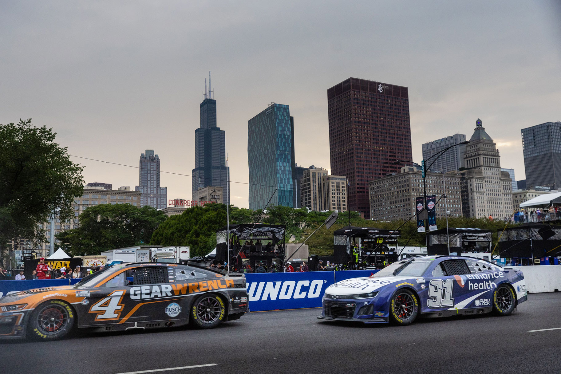 Shane van Gisbergen and Kevin Harvick compete during the NASCAR Chicago Street Race in Grant Park in Chicago on July 2, 2023
