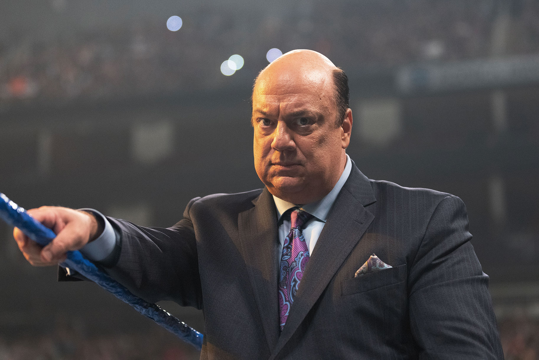 Paul Heyman looking into the camera with a stern look on his face