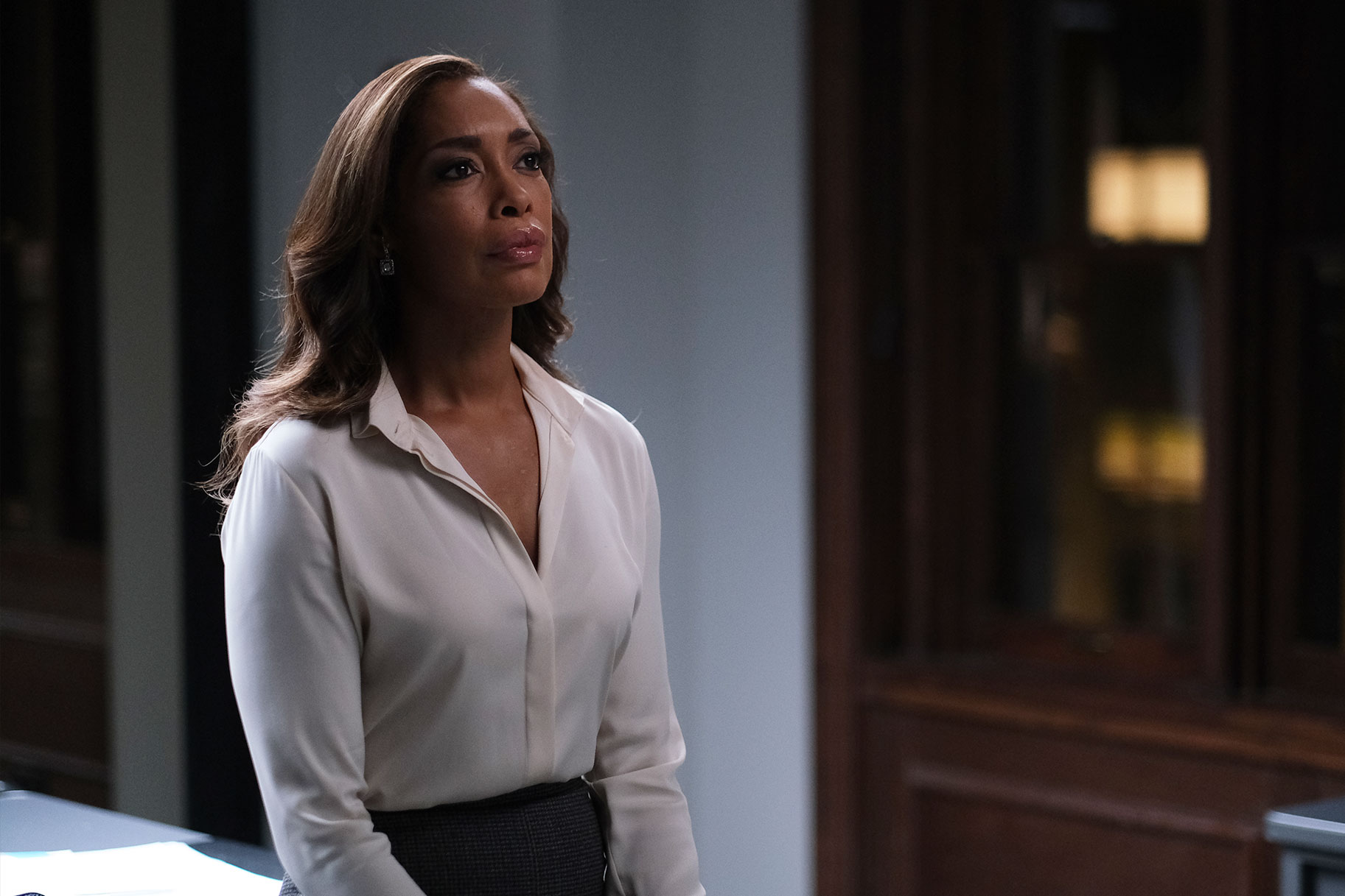 Gina Torres as Jessica Pearson looking thoughtful in a scene from Pearson
