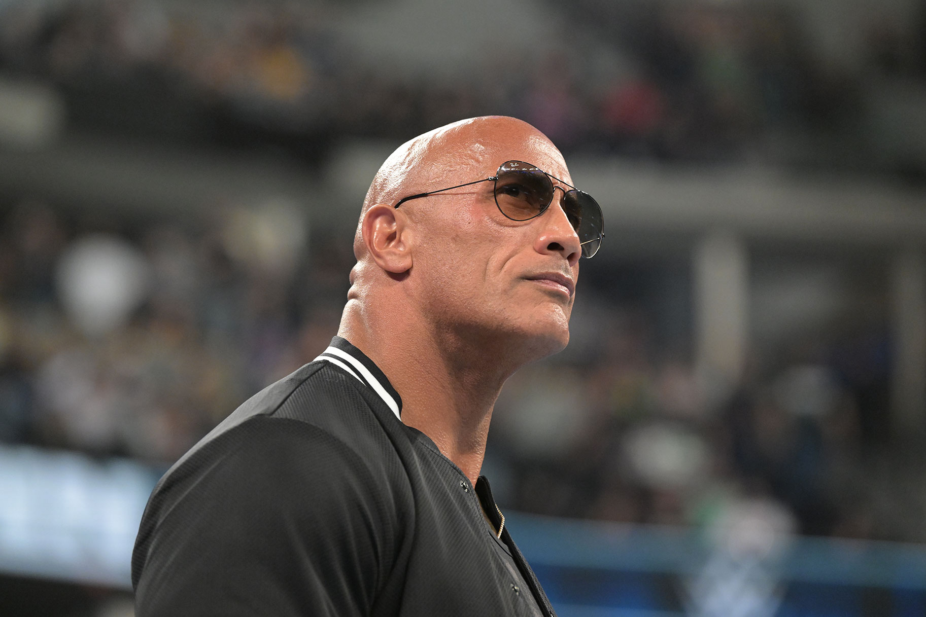 Close up of The Rock as he stands in the ring