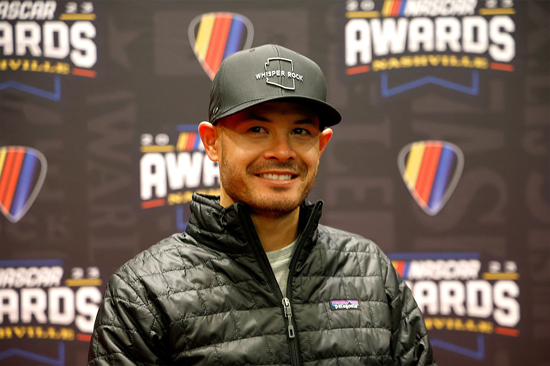 Kyle Larson speaks to the media during the media scrum at Music City Center on November 30, 2023 in Nashville, Tennessee.