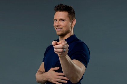 Mike Mizanin smiling and pointing at the camera