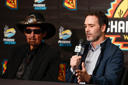 Former NASCAR driver, Jimmie Johnson (R) speaks to the media announcing he has invested in an ownership stake in the Petty GMS Motorsports as team owner, and NASCAR Hall of Famer Richard Petty looks on