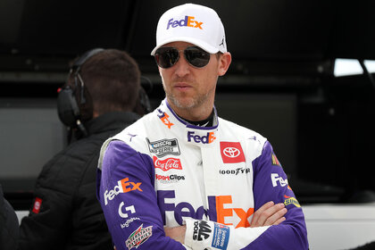Denny Hamlin, driver of the #11 FedEx Express Toyota, waits on the grid during practice for the NASCAR Cup Series Pennzoil 400
