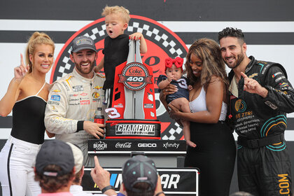 Austin Dillon and Paul Swan with their wives and children
