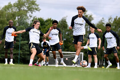 Conor Gallagher, Andrey Santos and Ethan Ampadu of Chelsea warm up during a training session at Chelsea Training Ground on July 13, 2023