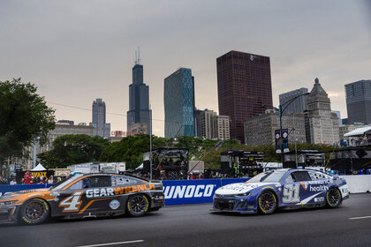 Shane van Gisbergen and Kevin Harvick compete during the NASCAR Chicago Street Race in Grant Park in Chicago on July 2, 2023