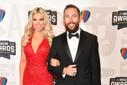 Ross Chastain posing on the red carpet with his girlfriend Erika Turner