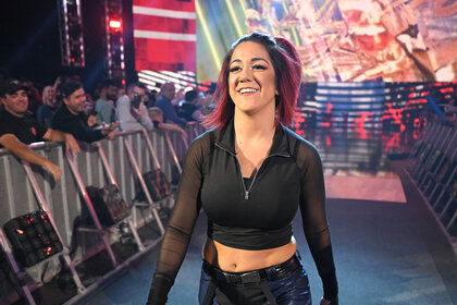 Bayley walks to the ring.