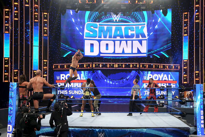 Wide view of the SmackDown ring during an 8 man match
