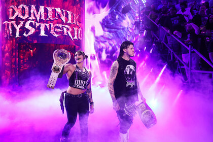 Rhea Ripley and Dominik Mysterio walk to the ring