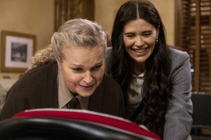 Deputy Liv Baker (Elizabeth Bowen) and Kate Hawthorne (Meredith Garretson) coo at a baby on Resident Alien Episode 407.