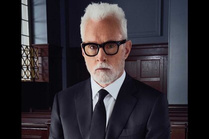 The Rainmaker star John Slattery posing as Leo Drummond in a courtroom